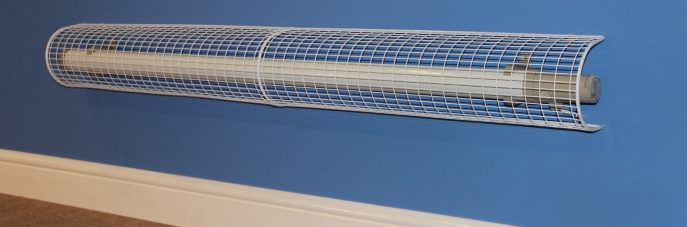 STG41 on blue wall AIANO STG41 thermostatic tube heater guard