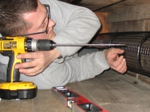 AIANO engineer installing a pipe guard for a church Aiano's provides a complete service solution to churches for pipe guards